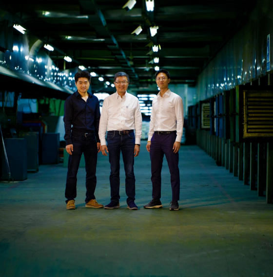 OPJ Studio team members standing in a jewelry production facility